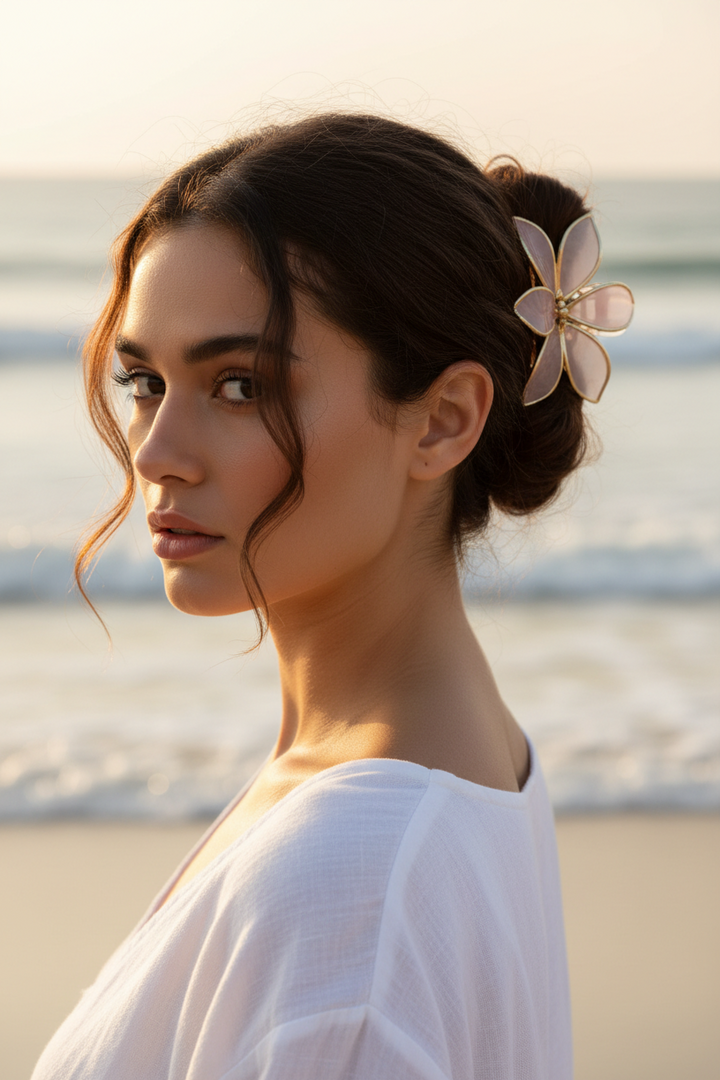 Pink flower-shaped hair clip with gold-colored edges